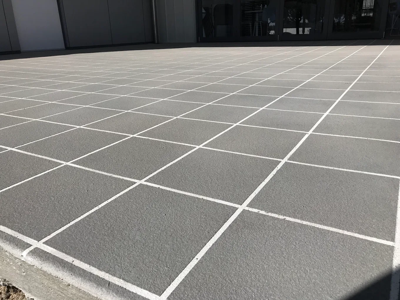 Stencil concrete pattern in limestone grey with charcoal joints